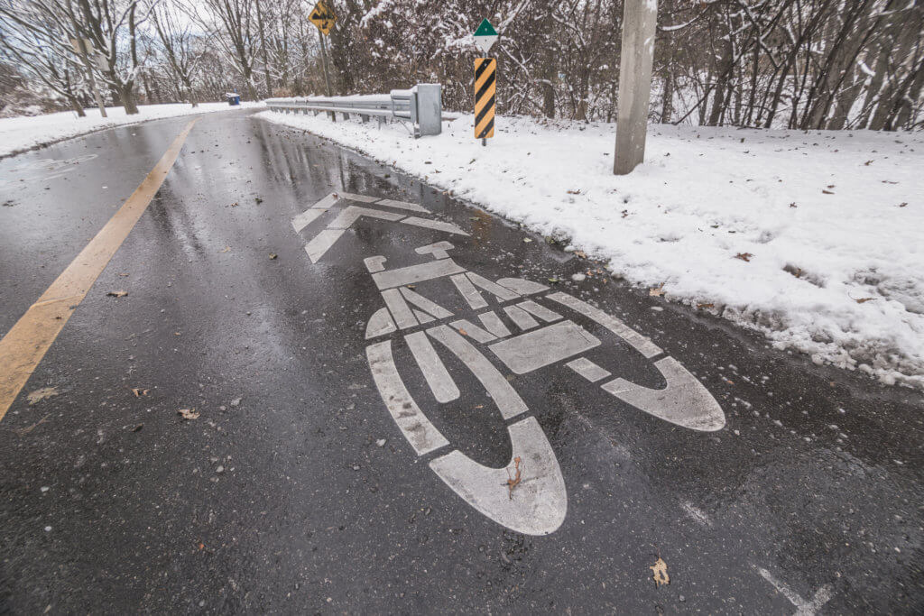 snowy winter bike lane markings road