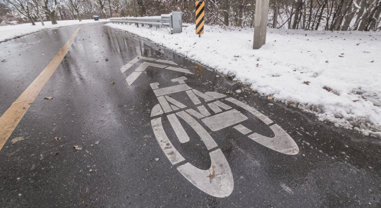 snowy winter bike lane markings road